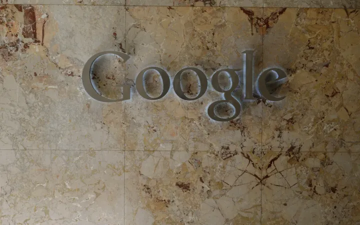Google logo on a marble wall at the Google Toronto office