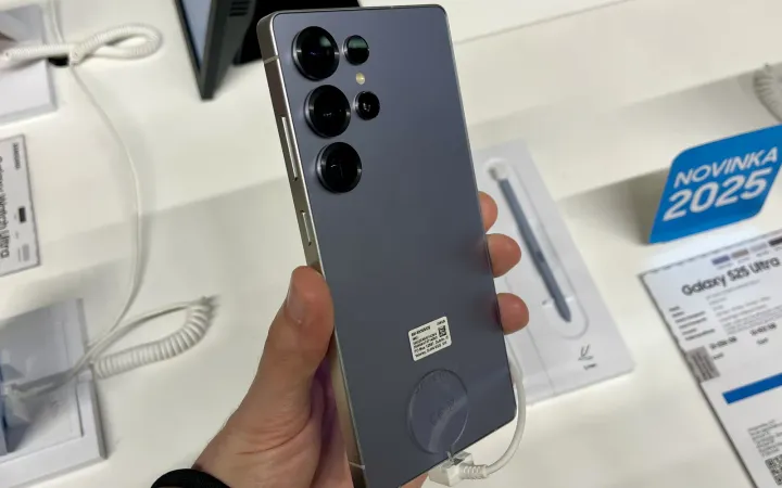 Samsung Galaxy S25 Ultra in Titanium Silverblue held in a hand at a store display