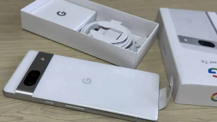 Google Pixel 7a Android phone lying next to its box