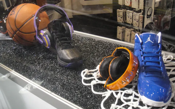 Skullcandy headphones on display next to sneakers at CES 2012